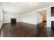 Open-concept living room with a fireplace and hardwood floors at 1388 Castle Creek Cir, Castle Rock, CO 80104