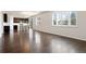 Open living room with wood floors and natural light at 1388 Castle Creek Cir, Castle Rock, CO 80104