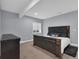 Bedroom with a decorative headboard bed, neutral colors, and a window at 413 N De Gaulle Ct, Aurora, CO 80018