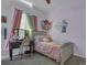 Bedroom featuring a bed and desk with pink curtains and decor at 413 N De Gaulle Ct, Aurora, CO 80018