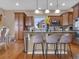 Stylish kitchen with granite countertops, stainless steel appliances, and a breakfast bar at 413 N De Gaulle Ct, Aurora, CO 80018