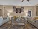 Comfortable living room with neutral tones, stylish decor, and cozy seating arrangement with modern furniture at 413 N De Gaulle Ct, Aurora, CO 80018
