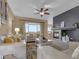 Cozy living room featuring a fireplace, comfortable seating, and an open floor plan with modern decor at 413 N De Gaulle Ct, Aurora, CO 80018