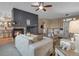 Open-concept living room showcasing a fireplace, modern decor, and a welcoming atmosphere with stylish furniture at 413 N De Gaulle Ct, Aurora, CO 80018