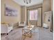 Cozy living room with neutral walls, plush carpet, and a stylish coffee table at 413 N De Gaulle Ct, Aurora, CO 80018