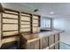 Finished basement includes a wet bar and built-in shelving at 839 E Easter Ave, Centennial, CO 80122