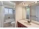 Bathroom boasts a bathtub, shower, and wood vanity at 839 E Easter Ave, Centennial, CO 80122