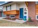 Close-up of the front door and well-maintained landscaping at 2641 S Magnolia St, Denver, CO 80224