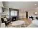 Cozy living room featuring a modern fireplace, stylish decor, and hardwood floors at 2641 S Magnolia St, Denver, CO 80224