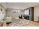 Cozy living room features a decorative brick fireplace and bright natural light at 2641 S Magnolia St, Denver, CO 80224