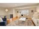 Open living area featuring hardwood floors, modern decor, and ample natural light at 2641 S Magnolia St, Denver, CO 80224
