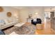Spacious living room showcasing hardwood floors, modern furniture, and a cozy atmosphere at 2641 S Magnolia St, Denver, CO 80224