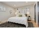 Cozy main bedroom features a modern rug, lots of natural light, and neutral decor at 2641 S Magnolia St, Denver, CO 80224