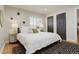 Comfortable main bedroom features lots of natural light and neutral decor at 2641 S Magnolia St, Denver, CO 80224
