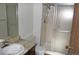 Bathroom with shower, new fixtures, and updated tiling at 13952 E Marina Dr # 304, Aurora, CO 80014