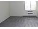 Cozy bedroom featuring soft carpet and a large window for natural light at 13952 E Marina Dr # 304, Aurora, CO 80014