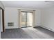 Bright living room with sliding glass doors to a balcony, perfect for enjoying the view at 13952 E Marina Dr # 304, Aurora, CO 80014