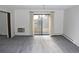 Bright living room with balcony access and carpet flooring at 13952 E Marina Dr # 304, Aurora, CO 80014