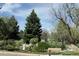 Landscaped pond with a waterfall and bench at 13952 E Marina Dr # 304, Aurora, CO 80014