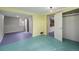 Basement area with colorful flooring, lighting, and closet at 1666 S Bryant St, Denver, CO 80219