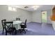 Spacious, open finished basement area with windows for natural light at 1666 S Bryant St, Denver, CO 80219