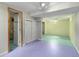 Basement with colorful flooring, closet, and open doorway at 1666 S Bryant St, Denver, CO 80219