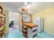 Basement area with kitchen and a view to an adjacent room at 1666 S Bryant St, Denver, CO 80219