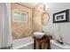 Cozy bathroom with stand alone bowl sink, shower and modern fixtures at 1666 S Bryant St, Denver, CO 80219
