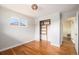 Bedroom featuring hardwood floors, closet with shelves, and a window view at 1666 S Bryant St, Denver, CO 80219