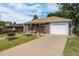 Beautiful single-Gathering home featuring an attached garage and a spacious driveway at 1666 S Bryant St, Denver, CO 80219