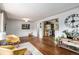 Cozy living room features hardwood floors, neutral paint, and stylish accents at 1666 S Bryant St, Denver, CO 80219