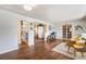 Inviting living room showcasing hardwood floors and seamless open floor plan at 1666 S Bryant St, Denver, CO 80219