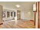 Well-lit basement area with wood-look floors and unique windows offering natural light and rock views at 6057 Red Hill Rd, Boulder, CO 80302