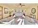 Serene bedroom with neutral decor, ceiling fan, and inviting seating area with comfortable chairs at 6057 Red Hill Rd, Boulder, CO 80302