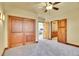 Spacious bedroom with hardwood doors leading to closet, and an ensuite bathroom at 6057 Red Hill Rd, Boulder, CO 80302