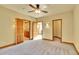 Spacious bedroom with multiple entryways and a ceiling fan at 6057 Red Hill Rd, Boulder, CO 80302
