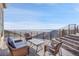 Scenic view from deck with seating, offering expansive mountain views at 6057 Red Hill Rd, Boulder, CO 80302