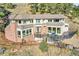 Expansive home featuring a brick chimney, large windows, and a spacious deck, perfect for outdoor entertaining at 6057 Red Hill Rd, Boulder, CO 80302