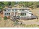 House exterior showing a custom deck and mature landscaping at 6057 Red Hill Rd, Boulder, CO 80302