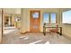 Bright hallway area leading to a room with a desk and chair overlooking scenic mountain views at 6057 Red Hill Rd, Boulder, CO 80302
