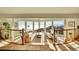 Bright living room featuring stylish furniture and floor-to-ceiling windows with scenic mountain views at 6057 Red Hill Rd, Boulder, CO 80302