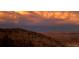 Panoramic mountain view with a colorful sunset and a vast landscape stretching to the horizon at 6057 Red Hill Rd, Boulder, CO 80302