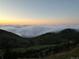 Tranquil mountain valley view filled with fog and scenic skies at 6057 Red Hill Rd, Boulder, CO 80302
