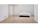 Tile floors, a door to the bathroom, and a comfortable bed with white pillows highlight this bedroom at 1580 Quince St, Denver, CO 80220