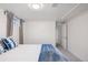 Neutral bedroom with a bed, wall to wall carpet, and a view into a hallway at 1580 Quince St, Denver, CO 80220