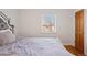Bedroom featuring a window view, a bed and natural light at 1580 Quince St, Denver, CO 80220