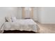Cozy bedroom features neutral tones, tile floors, and a plush white bed with decorative pillows at 1580 Quince St, Denver, CO 80220