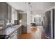 Modern kitchen featuring gray cabinets, granite countertops and stainless steel appliances at 1580 Quince St, Denver, CO 80220
