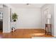 Bright living room features hardwood floors and a white painted wall at 1580 Quince St, Denver, CO 80220