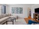 Stylish living room with decor and view to the connected bedroom at 1580 Quince St, Denver, CO 80220